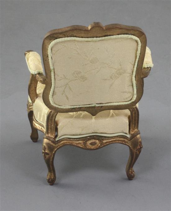 Denis Hillman. A Louis XV style gilt carved wood miniature fauteuil, height 3.75in.